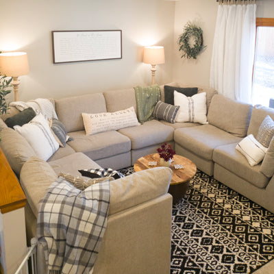 Lauren and Janelle from Stone + Suede updated the interior styling of this living room in Beaver Dam, Wisconsin to be in the transitional farmhouse style.